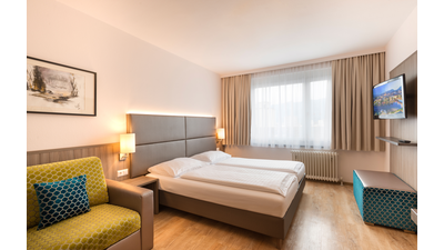 Klassik_Holzboden_Bett01_2.jpg © Hotel City Villach